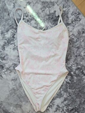 Dippin' Daisy's White One-Piece Swimsuit with Pale Pink Floral Print